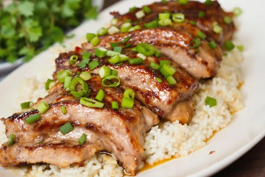 Serving delicious slow cook pork riblets garnished with chopped parsley and sliced green onions